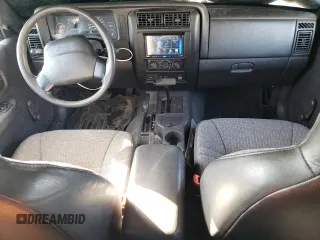 1999 Jeep Cherokee SE with VIN 1J4FF28S3XL551875, listed as a Copart auction lot 43057555 with 226,794 mi miles and Salvage title. Bid and sale history available at DreamBid. Image 8.
