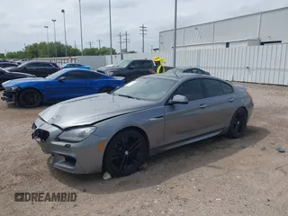 2014 BMW 6 Series 650i z VIN WBA6B2C55ED128934, wystawiony jako IAAI lot #42070641 z przebiegiem 102 597 mil mil oraz . Historia ofert i sprzedaży dostępna na DreamBid. Obrazek 2.