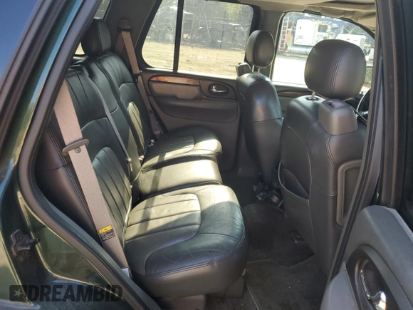 2003 GMC Envoy SLT with VIN 1GKDT13S032396374, listed as a Copart auction lot 74675134 with 115,280 mi miles and Salvage Title. Bid and sale history available at DreamBid. Image 11.