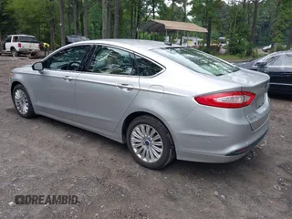 2013 Ford Fusion SE Hybrid z VIN 3FA6P0LU1DR291060, wystawiony jako IAAI lot #42731674 z przebiegiem 93 918 mil mil oraz . Historia ofert i sprzedaży dostępna na DreamBid. Obrazek 3.