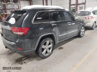 2011 Jeep Grand Cherokee Overland with VIN 1J4RR6GTXBC701186, listed as a IAAI auction lot 41553697 with 172,317 mi miles. Bid and sale history available at carsss.com. Image 4.