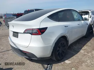 2022 Tesla Model Y Long Range with VIN 7SAYGDEE4NF428434, listed as a IAAI auction lot 41578503 with 35,460 mi miles and . Bid and sale history available at DreamBid. Image 4.