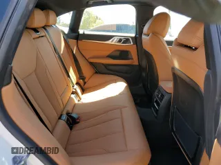 2023 BMW i4 eDrive40 z VIN WBY73AW05PFN75140, wystawiony jako Copart lot #51791515 z przebiegiem 28 426 mil mil oraz Szkody całkowita. Historia ofert i sprzedaży dostępna na DreamBid. Obrazek 10.