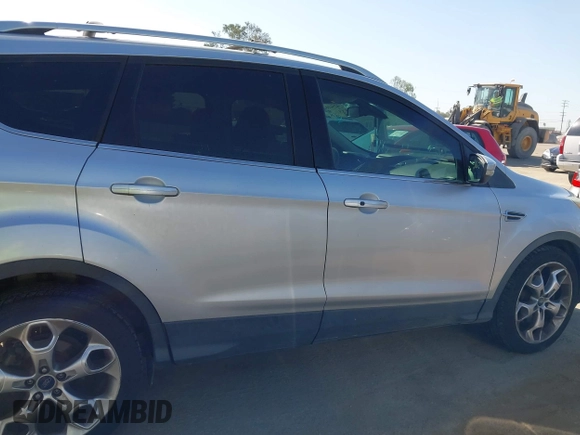 2015 Ford Escape Titanium with VIN 1FMCU0J90FUA43720, listed as a IAAI auction lot 42541048 with 98,948 mi miles and . Bid and sale history available at DreamBid. Image 13.