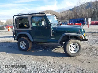 2000 Jeep Wrangler Sahara with VIN 1J4FA59S0YP724521, listed as a IAAI auction lot 41574689 with 167,584 mi miles. Bid and sale history available at carsss.com. Image 13.