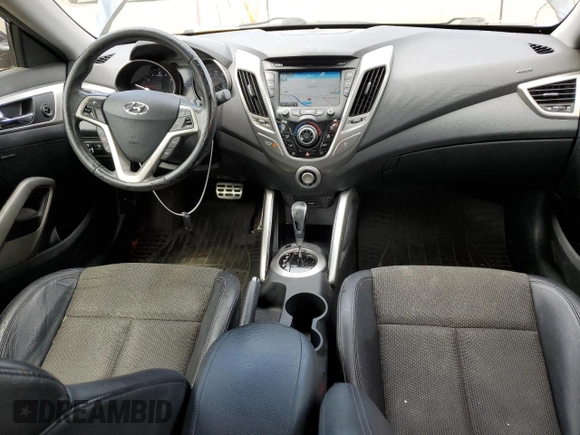 2013 Hyundai Veloster w/Gray Int z VIN KMHTC6AD9DU110094, wystawiony jako Copart lot #64660645 z przebiegiem 149 746 mil mil oraz Szkoda całkowita • Salvage title. Historia ofert i sprzedaży dostępna na DreamBid. Obrazek 8.
