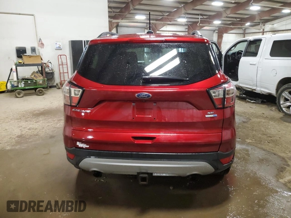 2018 Ford Escape SE z VIN 1FMCU9GD6JUB41465, wystawiony jako Copart lot #51332725 z przebiegiem 170 510 mil mil oraz Czysty tytuł • Clean title. Historia ofert i sprzedaży dostępna na DreamBid. Obrazek 6.