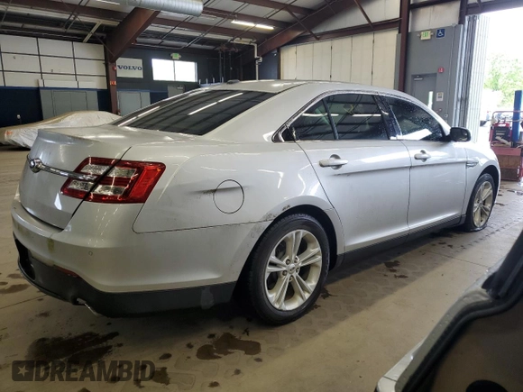2014 Ford Taurus SEL z VIN 1FAHP2E86EG128370, wystawiony jako Copart lot #58216645 z przebiegiem 95 488 mil mil oraz Czysty tytuł • Clean title. Historia ofert i sprzedaży dostępna na DreamBid. Obrazek 3.