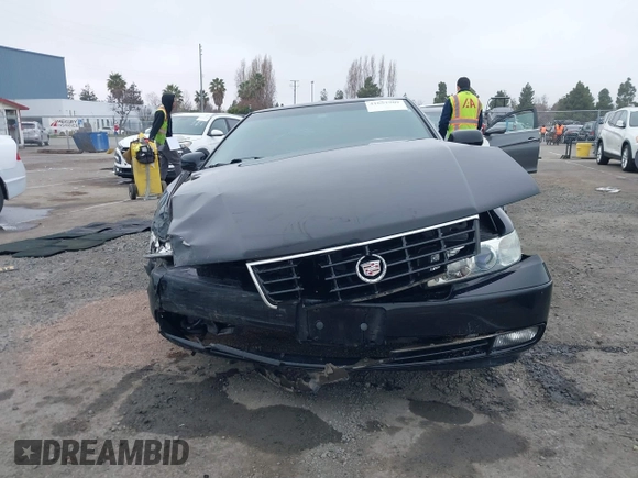2002 Cadillac Seville Touring STS z VIN 1G6KY54982U239673, wystawiony jako IAAI lot #41657709 z przebiegiem 92 224 mil mil oraz . Historia ofert i sprzedaży dostępna na DreamBid. Obrazek 13.