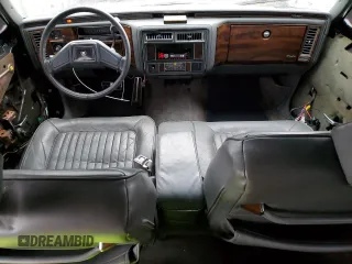 1989 Cadillac Brougham z VIN 1G6DW51Y9KR725809, wystawiony jako Copart lot #80902764 z przebiegiem 56 033 mil mil oraz Szkody całkowita. Historia ofert i sprzedaży dostępna na DreamBid. Obrazek 8.
