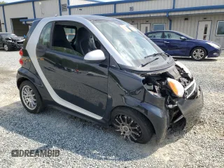 2013 Smart fortwo Pure with VIN WMEEJ3BA9DK670264, listed as a Copart auction lot 52817215 with 51,434 mi miles and Salvage Title. Bid and sale history available at DreamBid. Image 4.