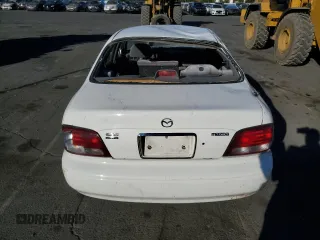 1999 Mazda 626 LX with VIN 1YVGF22D4X5882600, listed as a Copart auction lot 69031604 with 0 mi miles and Salvage Title. Bid and sale history available at carsss.com. Image 6.