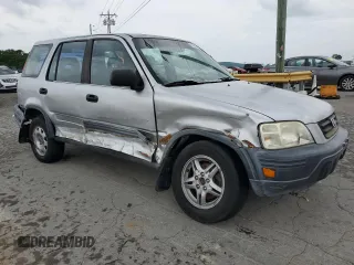 1999 Honda CR-V LX z VIN JHLRD1847XC040936, wystawiony jako Copart lot #56286075 z przebiegiem 296 489 mil mil oraz Szkoda całkowita • Salvage title. Historia ofert i sprzedaży dostępna na DreamBid. Obrazek 4.