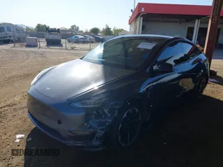 2022 Tesla Model Y Long Range with VIN 7SAYGDEE2NA017434, listed as a IAAI auction lot 41842025 with 35,164 mi miles and . Bid and sale history available at DreamBid. Image 2.