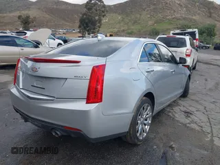 2018 Cadillac ATS Luxury RWD z VIN 1G6AB5RX6J0110860, wystawiony jako IAAI lot #41556662 z przebiegiem 63 886 mil mil oraz . Historia ofert i sprzedaży dostępna na DreamBid. Obrazek 4.