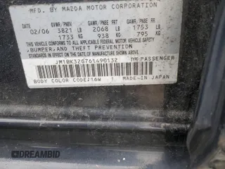 2006 Mazda 3 i Touring with VIN JM1BK32G761490132, listed as a Copart auction lot 52937645 with 146,299 mi miles and Salvage Title. Bid and sale history available at DreamBid. Image 14.