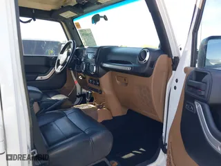 2012 Jeep Wrangler Unlimited Sahara with VIN 1C4BJWEG2CL117080, listed as a IAAI auction lot 41868590 with 92,475 mi miles. Bid and sale history available at carsss.com. Image 5.