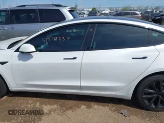 2020 Tesla Model 3 Standard Range Plus with VIN 5YJ3E1EA3LF785951, listed as a IAAI auction lot 41919339 with 63,025 mi miles and . Bid and sale history available at carsss.com. Image 13.