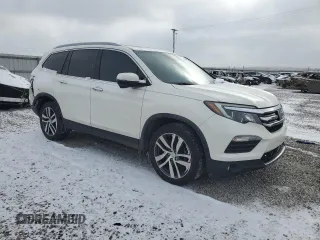 2018 Honda Pilot Touring z VIN 5FNYF6H99JB028034, wystawiony jako Copart lot #45143085 z przebiegiem 70 060 mil mil oraz Szkoda całkowita • Salvage title. Historia ofert i sprzedaży dostępna na DreamBid. Obrazek 4.