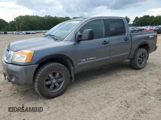 2015 Nissan Titan Pro-4X with VIN 1N6BA0EC7FN502411, listed as a Copart auction lot 62677635 with 123,822 mi miles and Salvage title. Bid and sale history available at DreamBid. Image 1.