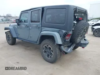 2015 Jeep Wrangler Unlimited Rubicon Hard Rock z VIN 1C4HJWFG1FL679873, wystawiony jako IAAI lot #41508722 z przebiegiem 97 165 mil mil oraz . Historia ofert i sprzedaży dostępna na DreamBid. Obrazek 3.
