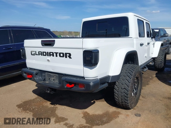 2021 Jeep Gladiator Rubicon with VIN 1C6JJTBG4ML536085, listed as a IAAI auction lot 41898204 with 39,627 mi miles and . Bid and sale history available at DreamBid. Image 4.