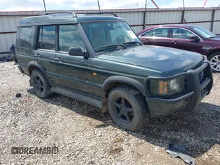 2003 Land Rover Discovery z VIN SALTY164X3A799072, wystawiony jako IAAI lot #42371522 z przebiegiem 106 157 mil mil oraz . Historia ofert i sprzedaży dostępna na DreamBid. Obrazek 1.