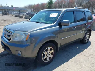 2011 Honda Pilot Touring with VIN 5FNYF4H94BB035415, listed as a IAAI auction lot 42126738 with 239,273 mi miles. Bid and sale history available at carsss.com. Image 18.