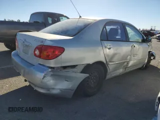 2003 Toyota Corolla CE with VIN 1NXBR32E13Z155142, listed as a Copart auction lot 79714184 with 299,999 mi miles and Salvage Title. Bid and sale history available at DreamBid. Image 3.