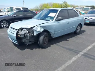 2005 Hyundai Accent GLS z VIN KMHCG45C85U591452, wystawiony jako IAAI lot #42114303 z przebiegiem 173 832 mil mil oraz . Historia ofert i sprzedaży dostępna na DreamBid. Obrazek 2.