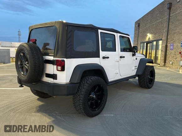 2018 Jeep Wrangler JK Unlimited Sport S with VIN 1C4BJWDG3JL805961, listed as a Copart auction lot 42876675 with 58,839 mi miles and Salvage Title. Bid and sale history available at carsss.com. Image 4.