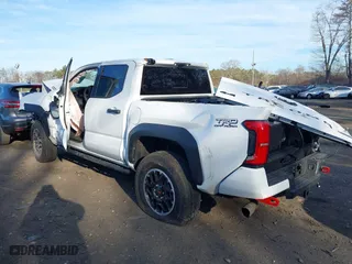 2024 Toyota Tacoma 4WD TRD Sport Hybrid with VIN 3TYLC5LN2RT003005, listed as a IAAI auction lot 41742427 with 1 mi miles. Bid and sale history available at carsss.com. Image 14.