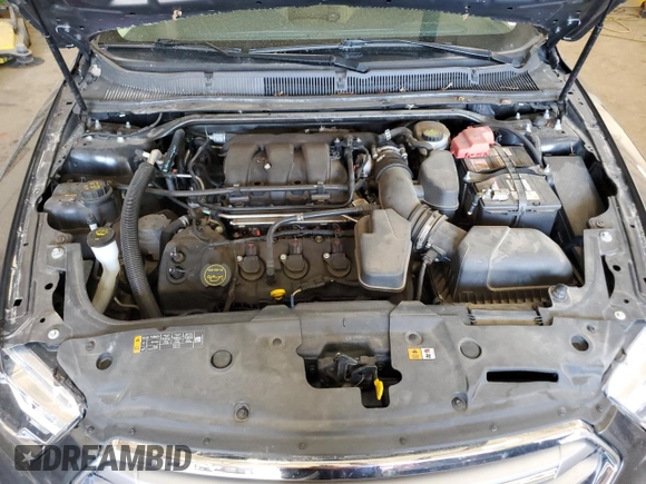 2015 Ford Taurus SEL with VIN 1FAHP2E84FG102318, listed as a Copart auction lot 61744685 with 82,149 mi miles and Salvage title. Bid and sale history available at DreamBid. Image 11.