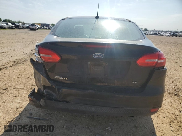2018 Ford Focus SE with VIN 1FADP3F2XJL262394, listed as a Copart auction lot 53642095 with 138,903 mi miles and Salvage title. Bid and sale history available at DreamBid. Image 6.