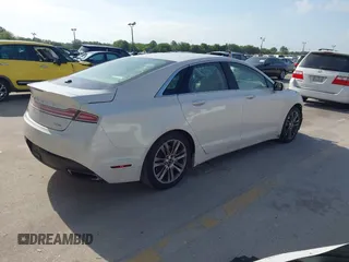 2014 Lincoln MKZ z VIN 3LN6L2G9XER812698, wystawiony jako IAAI lot #42112325 z przebiegiem 144 227 mil mil oraz . Historia ofert i sprzedaży dostępna na DreamBid. Obrazek 4.