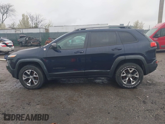 2014 Jeep Cherokee Trailhawk with VIN 1C4PJMBB5EW120432, listed as a IAAI auction lot 41973114 with 88,795 mi miles. Bid and sale history available at carsss.com. Image 14.