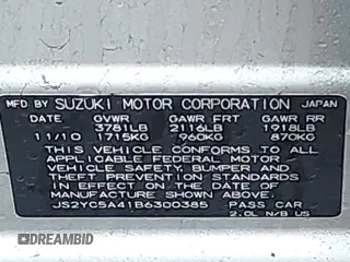 2011 Suzuki SX4 with VIN JS2YC5A41B6300385, listed as a IAAI auction lot 41570810 with 117,847 mi miles and . Bid and sale history available at DreamBid. Image 9.