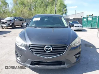 2016 Mazda CX-5 Touring z VIN JM3KE2CY4G0708972, wystawiony jako IAAI lot #42043013 z przebiegiem 157 573 mil mil oraz . Historia ofert i sprzedaży dostępna na DreamBid. Obrazek 6.