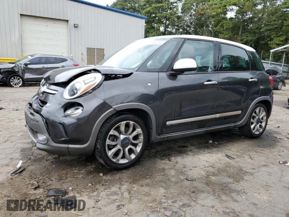 2014 FIAT 500L Trekking with VIN ZFBCFADH1EZ026288, listed as a Copart auction lot 71416144 with 97,674 mi miles and Salvage Title. Bid and sale history available at carsss.com. Image 1.