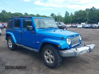 2015 Jeep Wrangler Unlimited Sahara with VIN 1C4BJWEG4FL677879, listed as a IAAI auction lot 42676097 with 85,821 mi miles and . Bid and sale history available at DreamBid. Image 18.
