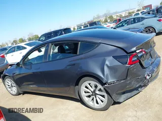 2021 Tesla Model 3 Long Range with VIN 5YJ3E1EB9MF997442, listed as a IAAI auction lot 41759875 with 87,059 mi miles. Bid and sale history available at carsss.com. Image 13.