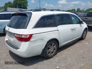 2012 Honda Odyssey EX-L with VIN 5FNRL5H63CB063684, listed as a IAAI auction lot 42576742 with 170,656 mi miles and . Bid and sale history available at DreamBid. Image 6.