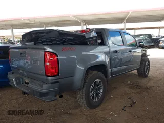 2021 Chevrolet Colorado 4WD Z71 z VIN 1GCGTDEN1M1168618, wystawiony jako IAAI lot #41683565 z przebiegiem 57 697 mil mil oraz . Historia ofert i sprzedaży dostępna na DreamBid. Obrazek 4.