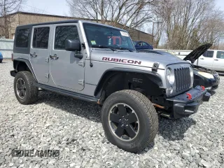 2015 Jeep Wrangler Unlimited Rubicon Hard Rock with VIN 1C4HJWFG4FL575054, listed as a Copart auction lot 51672655 with 130,405 mi miles and Clean title. Bid and sale history available at DreamBid. Image 4.