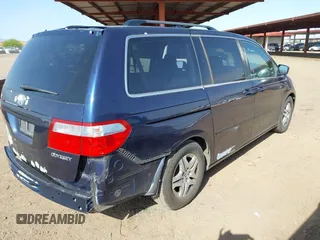 2005 Honda Odyssey EX-L with VIN 5FNRL38755B007567, listed as a IAAI auction lot 41952348 with 183,514 mi miles and . Bid and sale history available at carsss.com. Image 4.