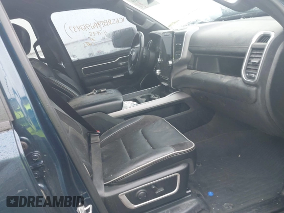 2023 Ram 1500 Laramie with VIN 1C6SRFJT9PN542437, listed as a IAAI auction lot 42256410 with 5 mi miles and . Bid and sale history available at DreamBid. Image 5.