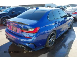 2020 BMW 3 Series M340i xDrive with VIN WBA5U9C06LFH24903, listed as a IAAI auction lot 41041530 with 55,949 mi miles and . Bid and sale history available at DreamBid. Image 4.