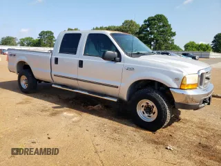1999 Ford F-350 XL with VIN 1FTSW31S2XEE89071, listed as a Copart auction lot 61016685 with 115,130 mi miles and Salvage title. Bid and sale history available at DreamBid. Image 4.