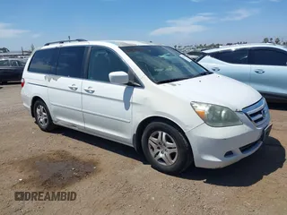 2007 Honda Odyssey EX with VIN 5FNRL38487B075936, listed as a IAAI auction lot 42052061 with 188,279 mi miles and . Bid and sale history available at DreamBid. Image 1.