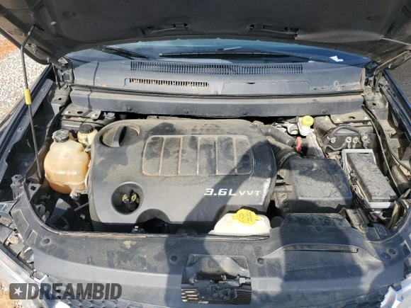 2014 Dodge Journey SXT z VIN 3C4PDDBG2ET242867, wystawiony jako Copart lot #51166995 z przebiegiem 208 568 mil mil oraz Szkoda całkowita • Salvage title. Historia ofert i sprzedaży dostępna na DreamBid. Obrazek 13.